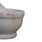 mortar and pestle, meticulously handcrafted from natural white marble and paired with a smooth wooden-accent handle